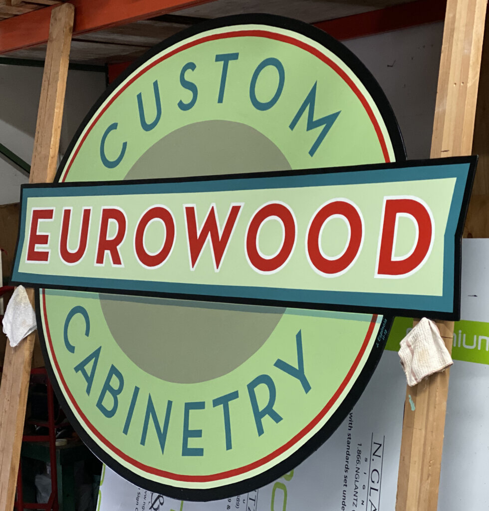 Campbell custom signs eurowood cabinetry wall after