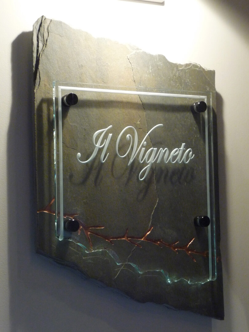 San Martin restaurant sign for il vigneto made of glass and stone