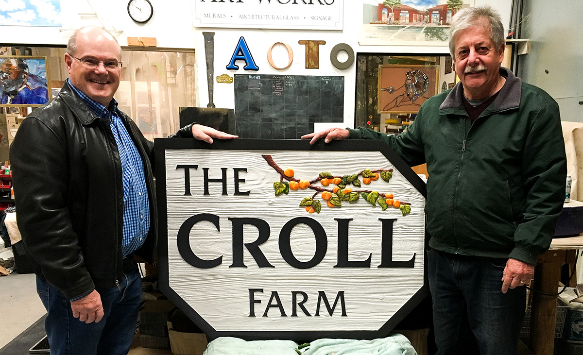 John Espinola with happy customer receiving the finished custom sign of The Croll Farm